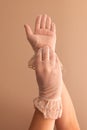 Female hands modeling vintage see through gloves