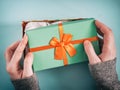 Female hands opening gift box Royalty Free Stock Photo