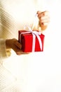 Female hands opening red gift box, copy space. Christmas, new year, birthday party, valentine`s day, mother`s and woman Royalty Free Stock Photo