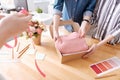 Female hands packing a dress into a box