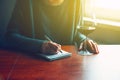 Hands with pen and glass of wine writing Royalty Free Stock Photo