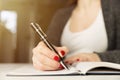 Female hands with pen writing on notebook. Diary, plans, journalist Royalty Free Stock Photo