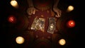 Female hands picking a few tarot cards from the deck, placing them on the table Royalty Free Stock Photo