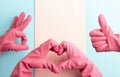 Female hands in pink rubber gloves show heart shape, ok sign, thumb up, Cleaning concept Royalty Free Stock Photo