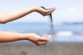 Female hands playing with sand. Summer holidays and vacation concept. Close up. Royalty Free Stock Photo