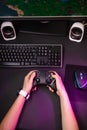 Female hands playing a computer game with a game joystick. Royalty Free Stock Photo