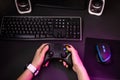 Female hands playing a computer game with a game joystick. Royalty Free Stock Photo