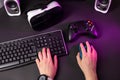 Female hands playing computer game with mouse and keyboard. Royalty Free Stock Photo