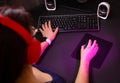 Female hands playing computer game with mouse and keyboard. Royalty Free Stock Photo