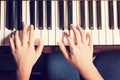 Female hands playing piano with vintage look Royalty Free Stock Photo