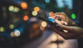 Female hands pointing on screen smart phone backdrop color light cars in night city street, tourist hipster waiting using mobile Royalty Free Stock Photo