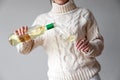 Female hands pour white wine from bottle to glass Royalty Free Stock Photo