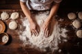 Female hands preparing dough on a wooden table