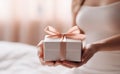 Female hands with present box holiday background Royalty Free Stock Photo