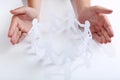 Hands protecting paper chain people Royalty Free Stock Photo