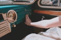 female hands in a retro car. Stylish old car. Retro Royalty Free Stock Photo