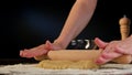 Female Hands Rolling Out Dough on the Table Royalty Free Stock Photo