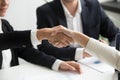 Female hands shaking at group meeting making partnership deal, c Royalty Free Stock Photo