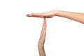 Female hands show a timeout or pause sign on white background.