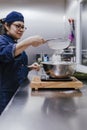 Female hands sifting flour by sieve in bowl for recipe. bakery concept Royalty Free Stock Photo