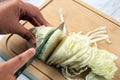 Female Hands SLicing White Cabbage on Wooden Board Royalty Free Stock Photo