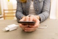 Female hands and smartphone. Woman`s hands trapped and wrapped o Royalty Free Stock Photo