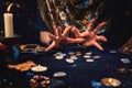 The female hands of the soothsayer read the runes. The concept of divination, astrology and predicting the future
