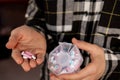 Female hands sorting pills Organizer weekly shots Closeup of medical pill box with doses of tablets for daily take