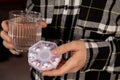 Female hands sorting pills Organizer weekly shots Glass of water Closeup of medical pill box with doses of tablets for Royalty Free Stock Photo