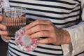 Female hands sorting pills Organizer weekly shots Glass of water Closeup of medical pill box with doses of tablets for