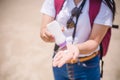 Female hands with sun protection cream at the beach. Skin care concep