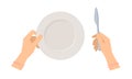 Female hands with table knife and empty plate.