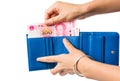 Female taking out Chinese yuan out of wallet Royalty Free Stock Photo