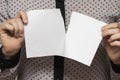 Female hands tearing a sheet of paper, closeup Royalty Free Stock Photo