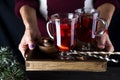 In female hands tray with hot mulled wine Royalty Free Stock Photo