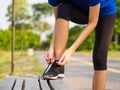 Female hands tying shoelace on running shoes before practice. Ru Royalty Free Stock Photo