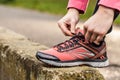 Female hands tying sporty shoes Royalty Free Stock Photo