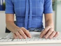 Female hands are typing on keyboard. Programmer go journalist working with computer Royalty Free Stock Photo