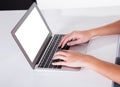 Female hands typing on a laptop keyboard Royalty Free Stock Photo
