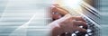 Hands typing on a laptop keyboard, light effect. panoramic banner Royalty Free Stock Photo