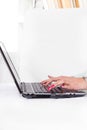 Female hands typing on laptop keyboard with red manicure Royalty Free Stock Photo