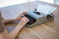 female hands typing on a typewriter