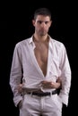 Female hands undress handsome man Royalty Free Stock Photo