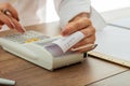 Female hands using adding machine Royalty Free Stock Photo