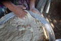 Female hands using flour in baking dough to make bread Royalty Free Stock Photo