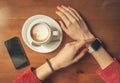 Female hands using smart watch with blank screen with coffee Royalty Free Stock Photo