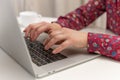 Female hands using typing on laptop notebook keyboard sit at home office desk working online business concept