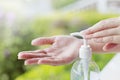 Female hands using wash hand sanitizer gel pump dispenser. Royalty Free Stock Photo