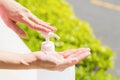 Female hands using wash hand sanitizer gel pump dispenser. Royalty Free Stock Photo