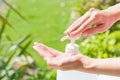 Female hands using wash hand sanitizer gel pump dispenser. Royalty Free Stock Photo